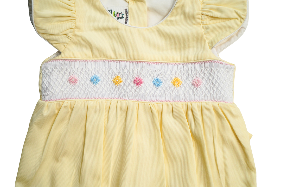 Yellow Baby girl Smocked romper. Hand embroidered with Hair Bow