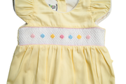 Yellow Baby girl Smocked romper. Hand embroidered with Hair Bow